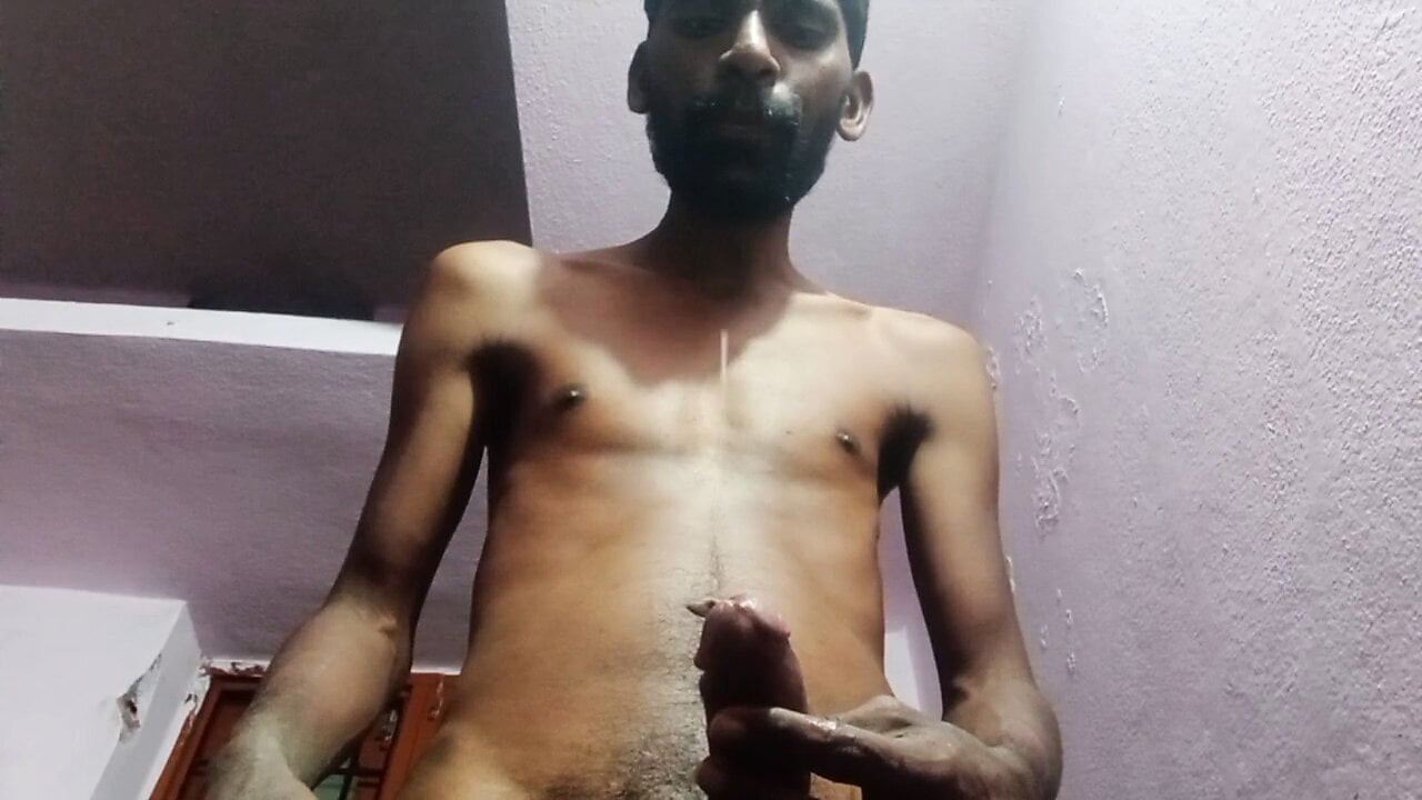 Rajesh masturbating, spitting on cock & cumming in glass 1