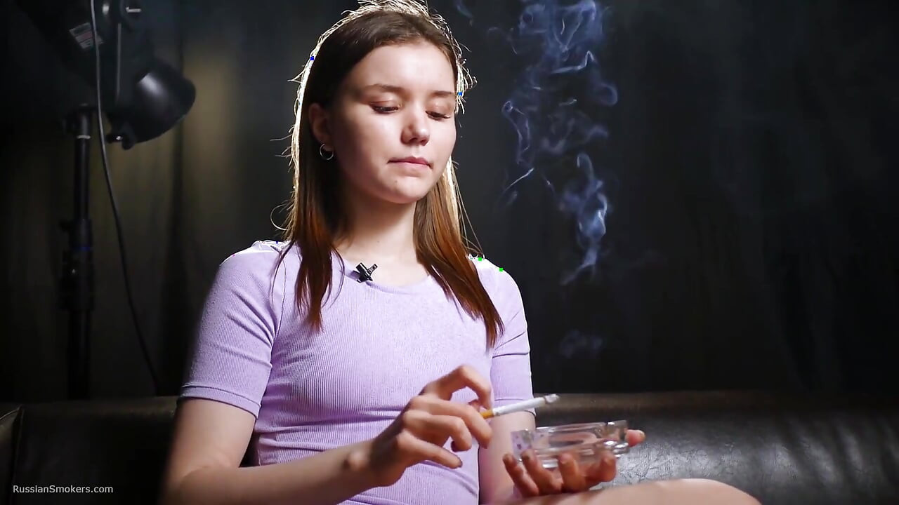 18 Aged Girl Is Smoking Two Strong Cork Cigarettes