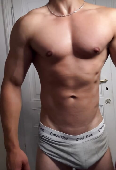 Athletic Muscle Guy Showing Off After a Workout