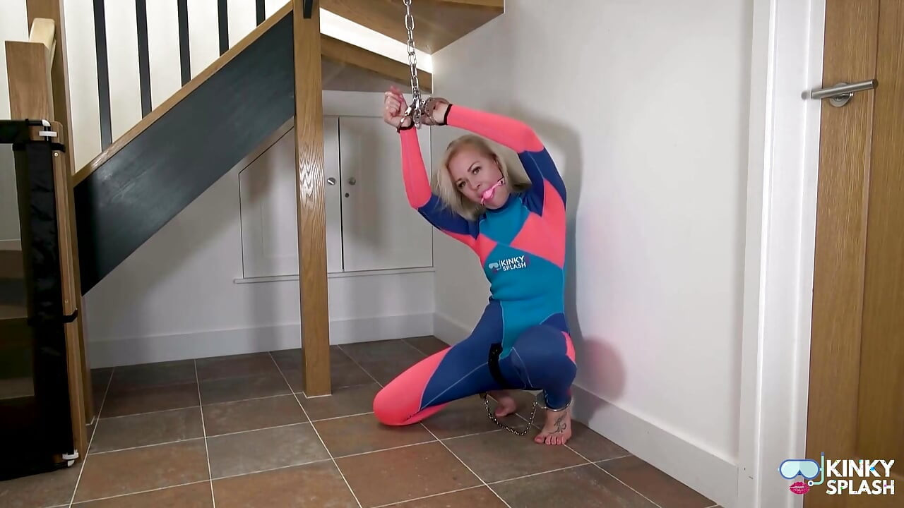 Neoprene Suit, Chains & Face‑cum Tease