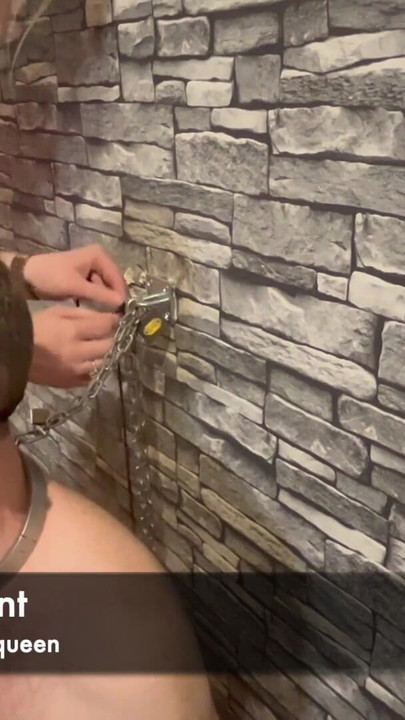 Iconic moment from "Femdom mistress punishes chastity slave leaves him chained to the wall naked"