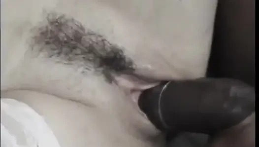 Sexy brunette slut gives head and takes a hard black cock on the bed