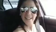Sexy MILF singing topless in his car