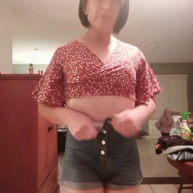 Tranny doing a little striptease.
