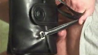 my cock is playing with a old leather handbag