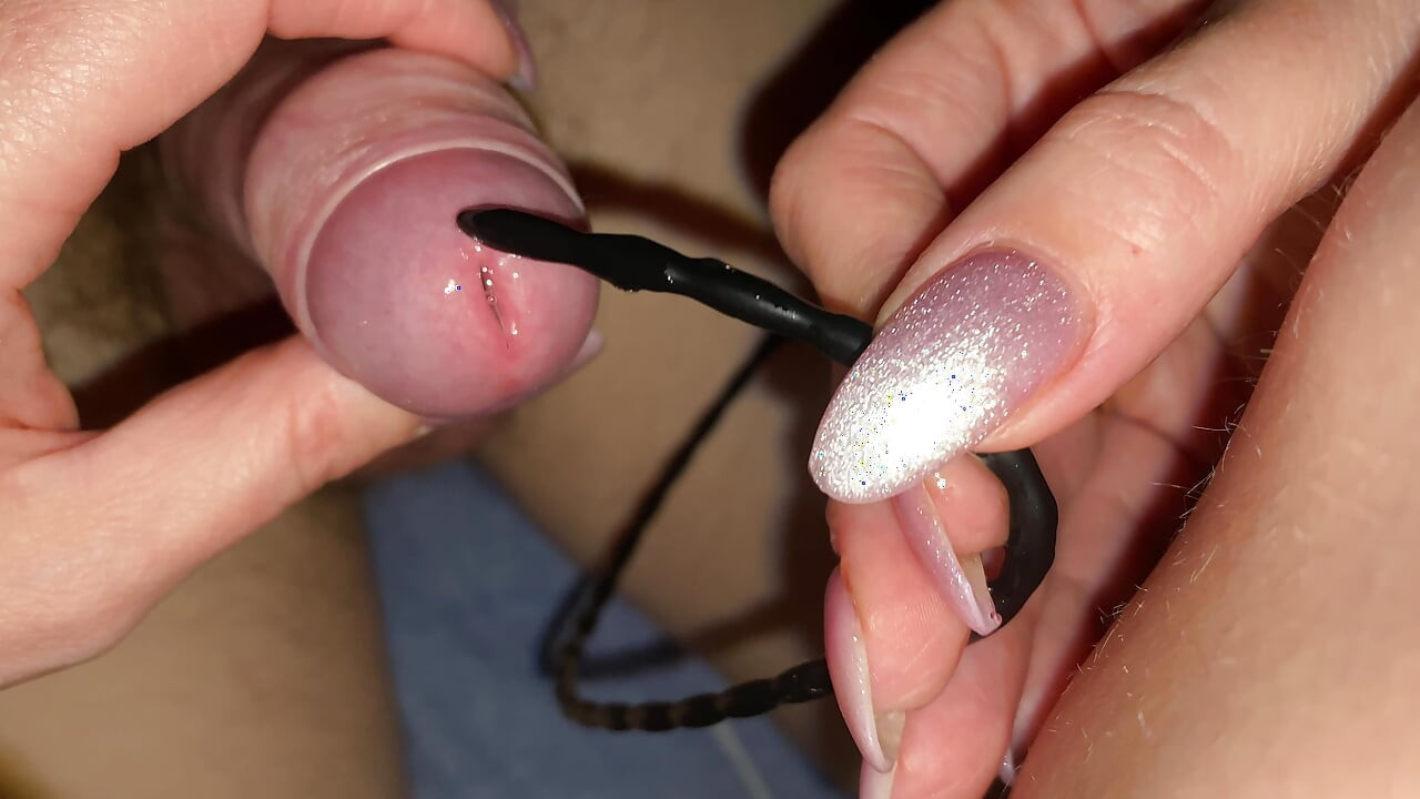 For the first time an urogenital probe is inserted into the pe nus for the first time, the man is moaning