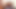 壁の穴から黒いペニスをしゃぶる2人のブロンド