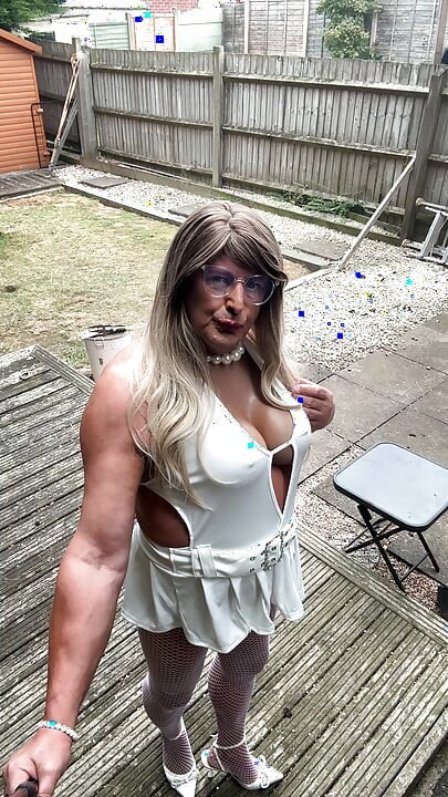 Sexy Crossdresser kellycd2022 in sexy white mini dress and fishnet pantyhose and heels