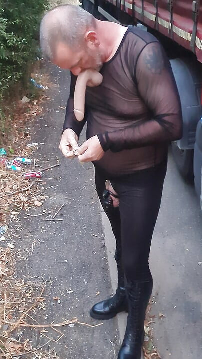 Cock locked sissy sucking dildo outdoors