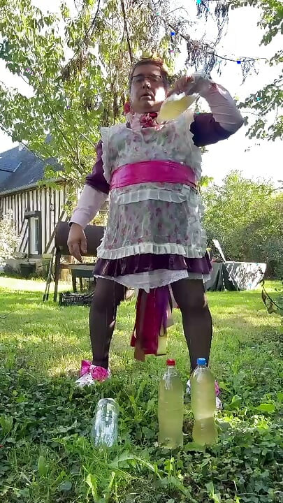 In gardener's outfit to take a piss shower with 4 bottles