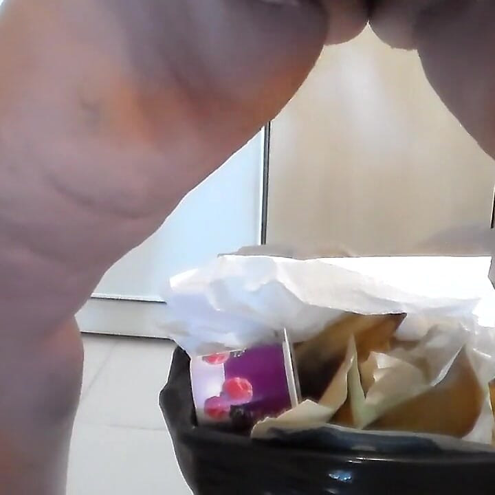 Jen is peeing into the trash can