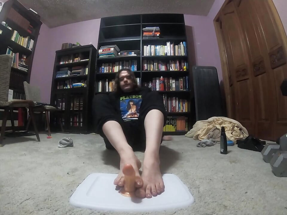 Chubby boy gives his dildo a footjob