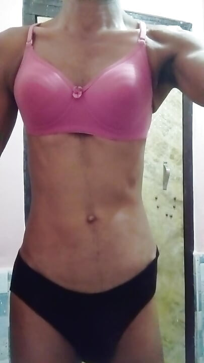 Sissy wearing pink bra and red panty