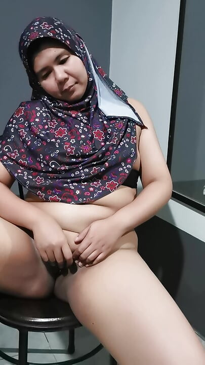 Sitting and provoking her husband