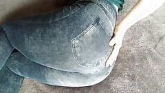 I pull down my denim leggings and blue panties and stick the dildo in my wet pussy with my white ass up