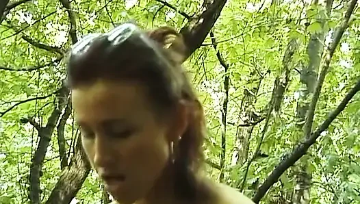 Adorable brunette masturbating outdoors