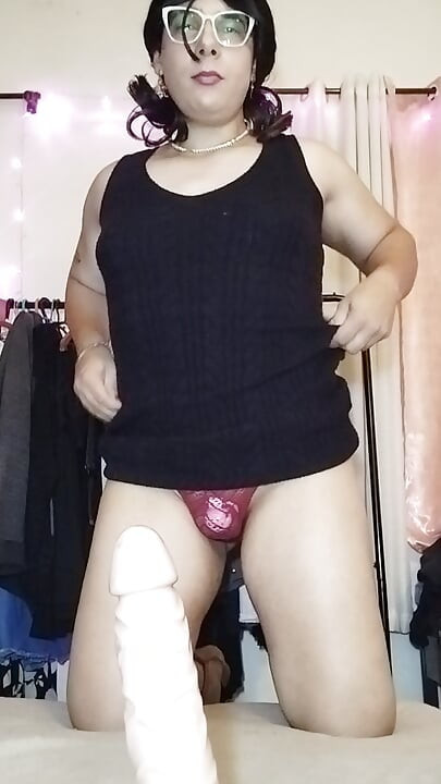 Trans with toy and cage in a chastity
