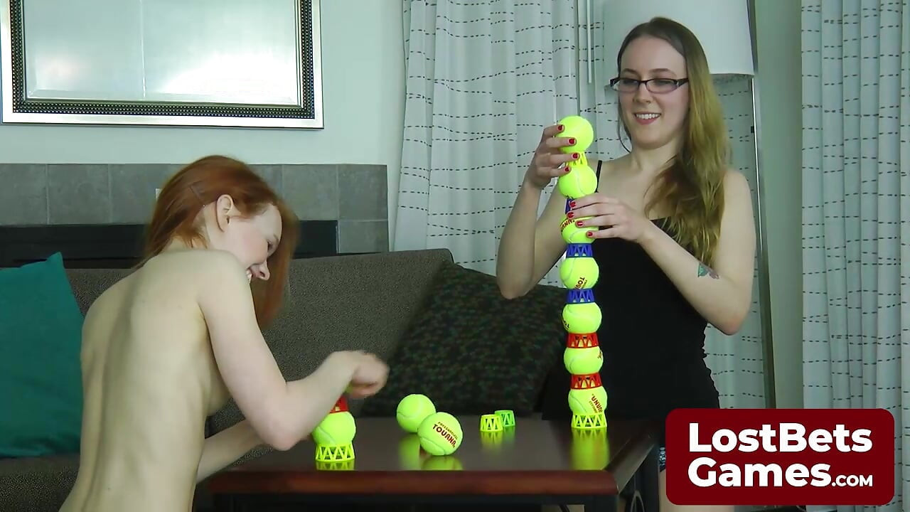 Two lesbians in an intimate Strip Ball Stacks challenge