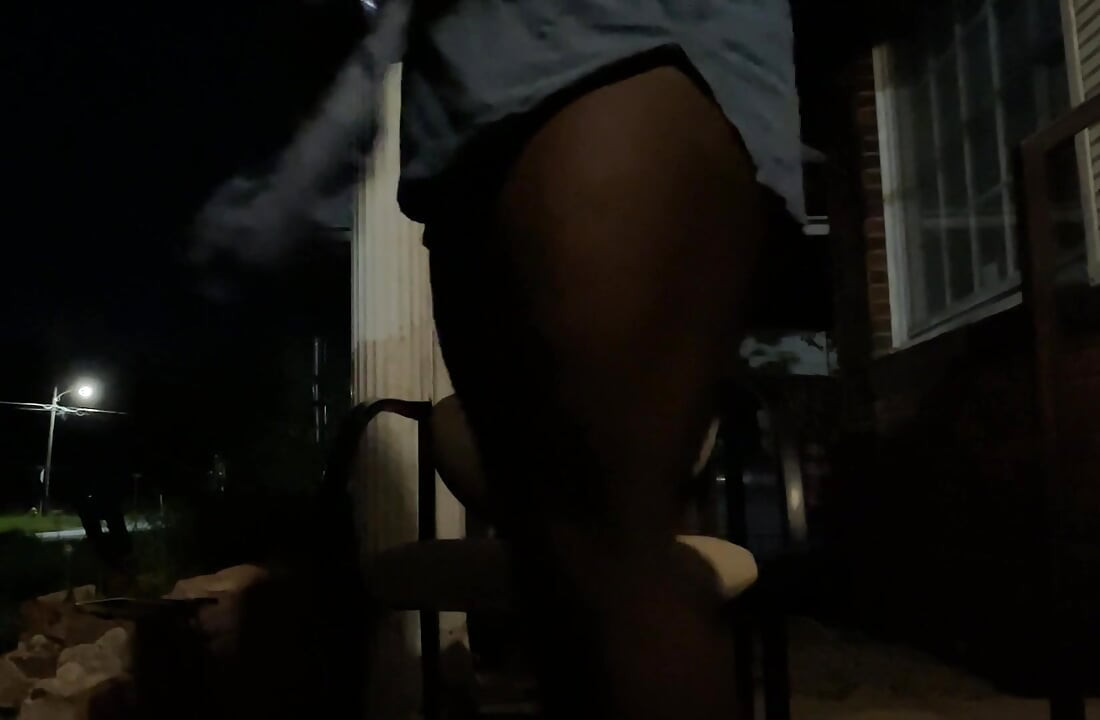 At Night Outside With The Porch Light On While Cars Passing By While I’m Playing Around On The Porch