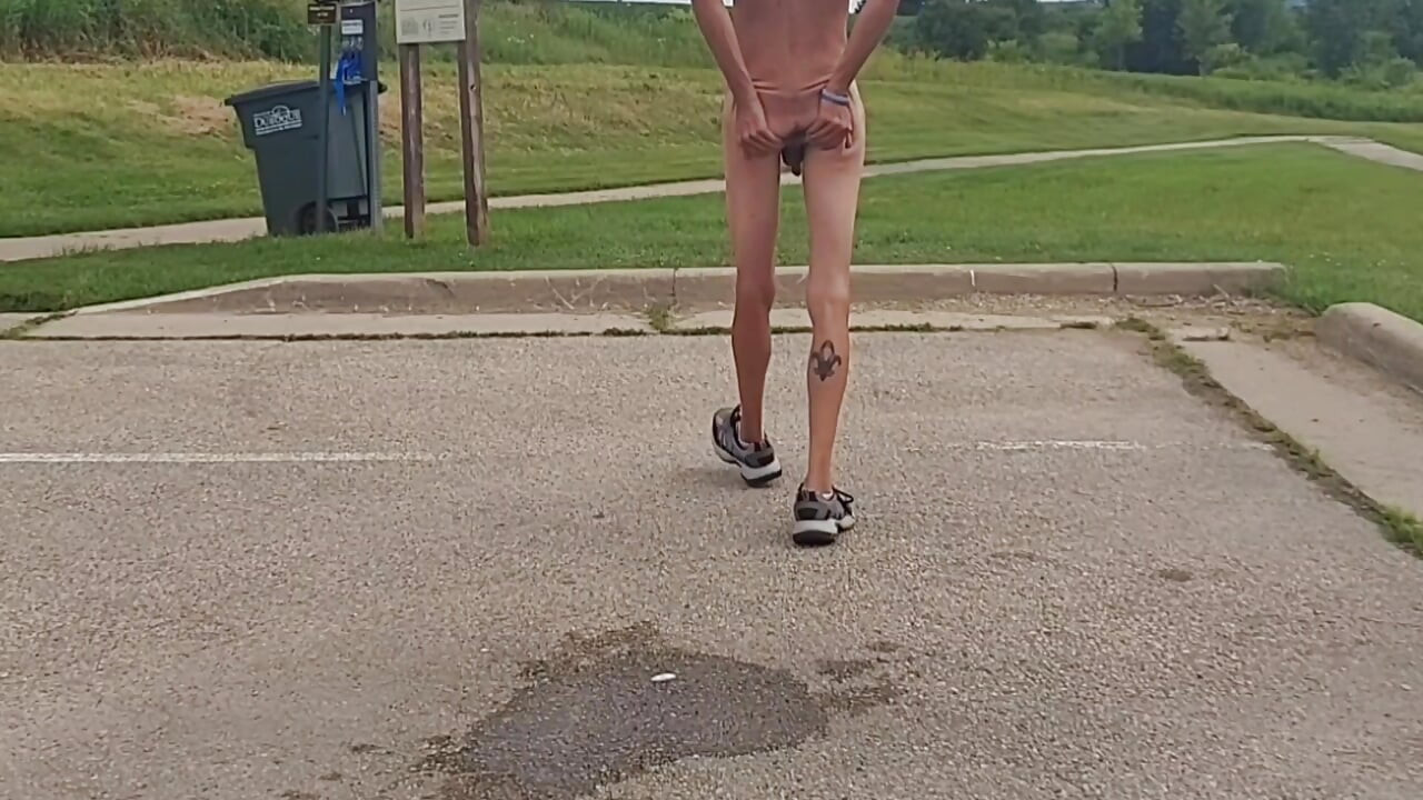 Naked and pissing in parking lot