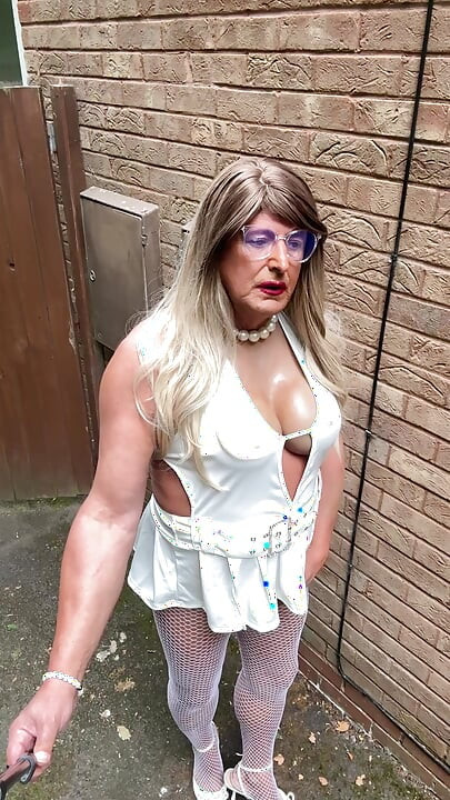 Sexy Crossdresser kellycd2022 in sexy white mini dress and fishnet pantyhose and heels