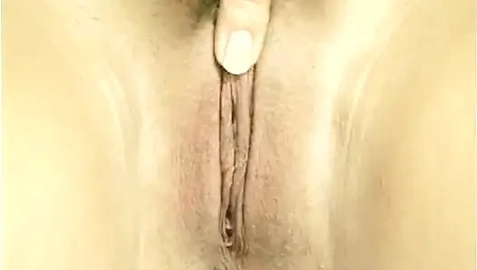 Sexy blonde babe is filling her snatch with a huge dildo