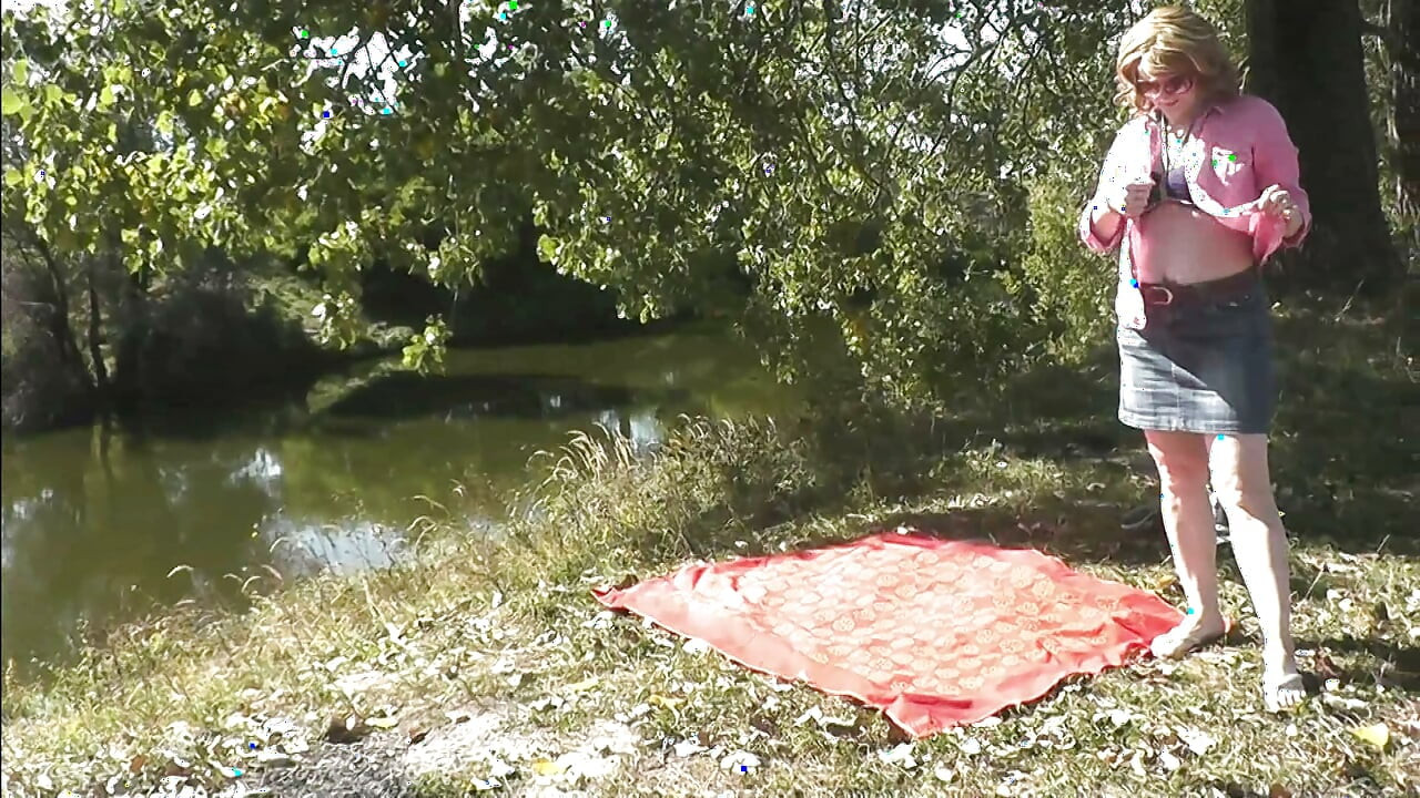 Sexy mature milf sunbathes naked on shore river fingering masturbating hairy pussy and orgasm. Outdoor Outside Naked public Solo