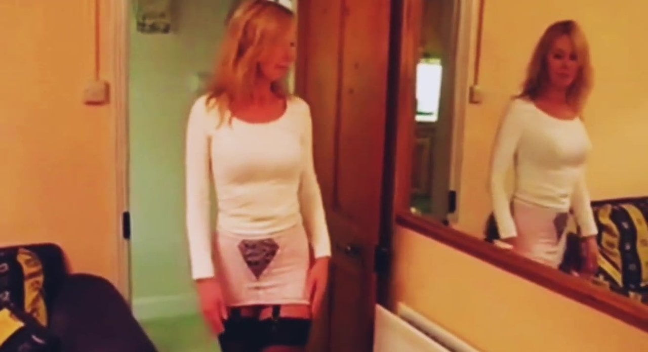 Shows her ass in pantyhose.
