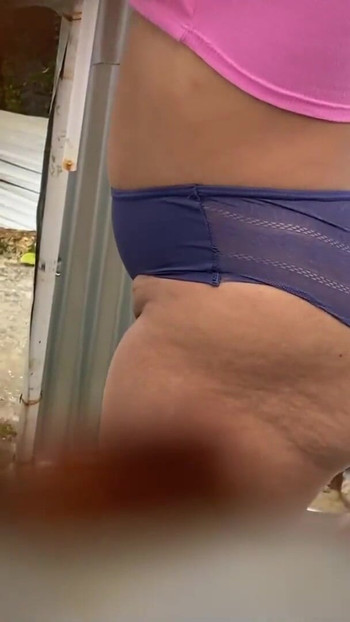 Key moment from "Camera records WOMAN in beach dressing room without realizing it (LATINA RECORDED BY PERVERT)"