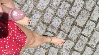 Joana Love walking barefoot with black nails outdoors