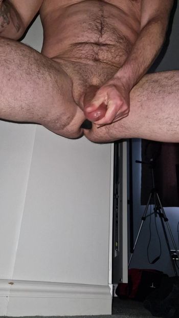 Milking my own cock with a huge but plug in my ass