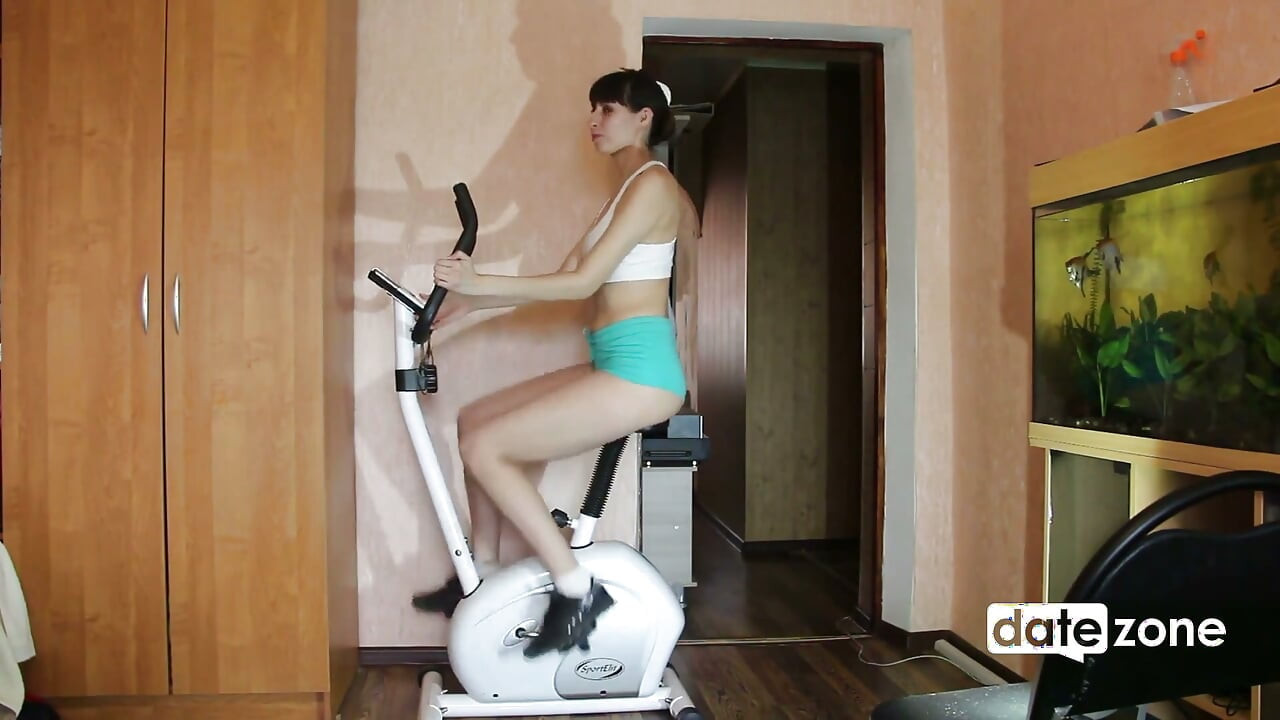 Leggy MILF Rides Exercise Bike with a Fake Cock on the Seat