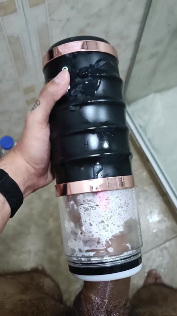 Powerful moment from "POV Big Uncut Cock Camilo Brown Using An Automatic Masturbation Toy To Get An Intense Cumshot Orgasm"