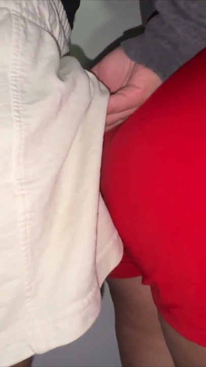 Big-assed Woman Touches the Erect Cock of a Stranger.