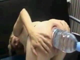 Big plastic water bottle stretches out her pussy