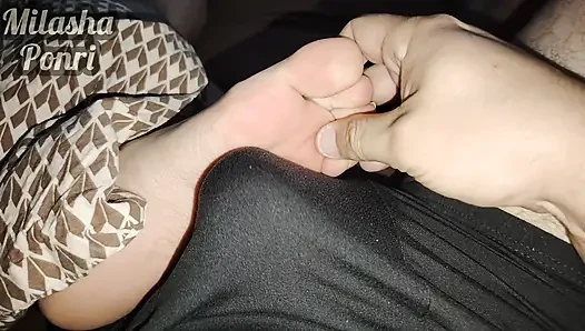 Stepsister's feet get a light massage while watching a movie