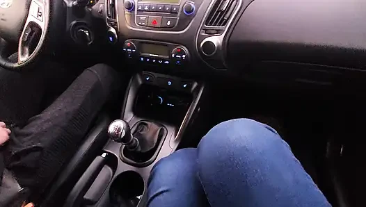 Amateur MILF in jeans and nylon socks gives a taxi driver a footjob