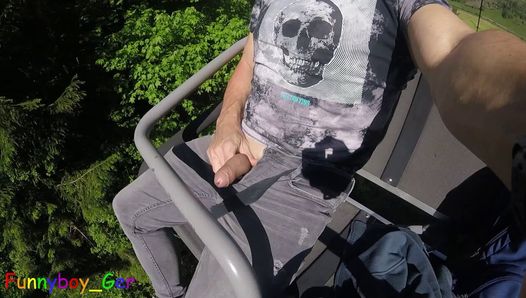 I jerk my hot cock from soft to hard in a moving chair lift. Public fun outside in the Bavarian Alps.