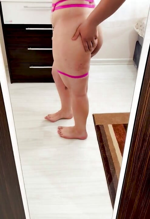 I put on my pink underwear and am playing with myself