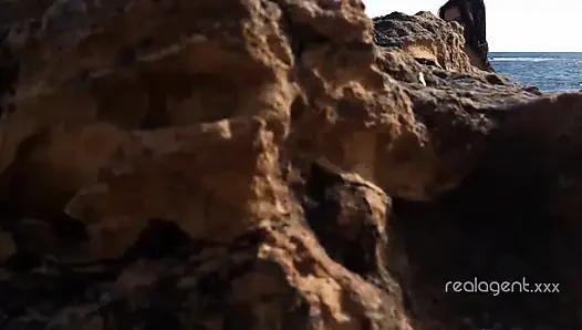 Alone lush Russian babe toys her cunt on the rock on the sea shore