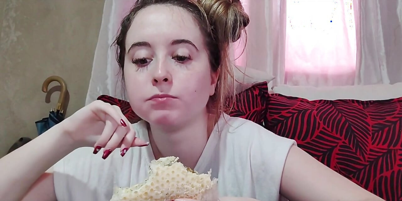Eating an omelette sandwich with cherry tomatoes