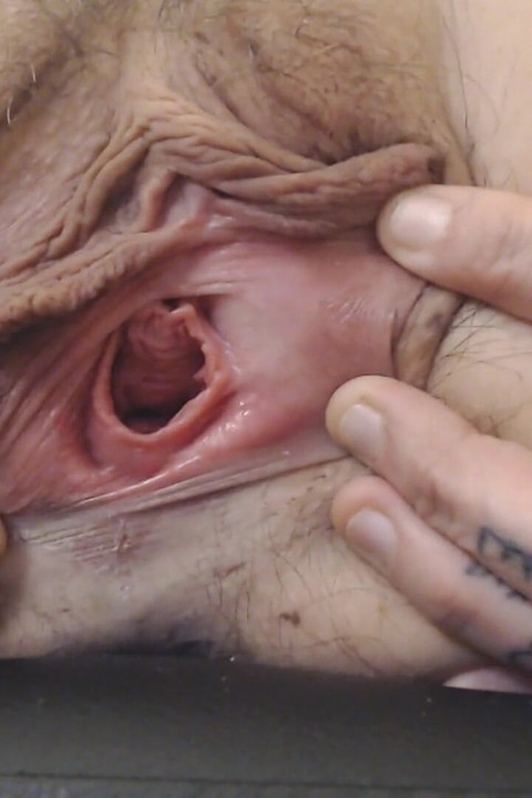 Gaping pussy lip spreading