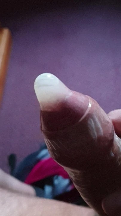Wanking into condom