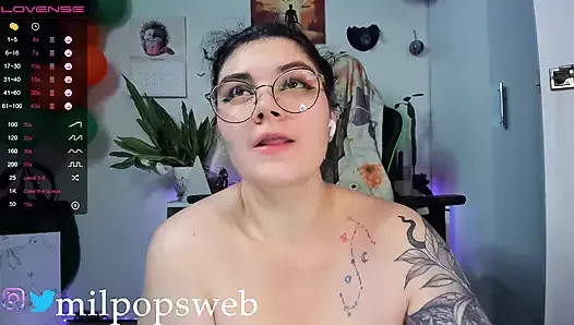 A cute curvy girl with a hairy pussy sparkles and opens her mouth, sticking out her tongue