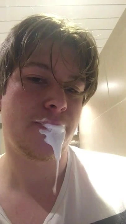 Young guy takes hot facial and spits it back out