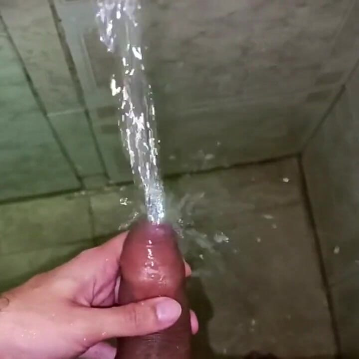 No hands water masturbation. Letting the stream of water fall on my big uncut Latino cock until it makes me cum.