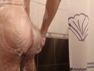 Hairy guy lathering himself in the shower