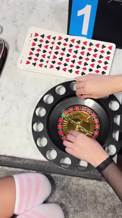 Two girls one guy handjob challenge party for Christmas with presents and roulette spinning | Clip 1