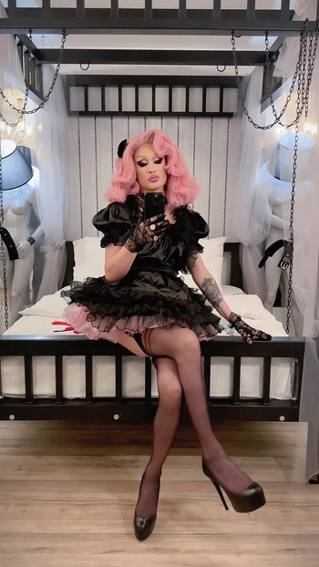 The room is silent, but the tension screams. Chains on the wall, leather on skin, and that one look that says