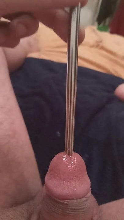 Playing alone with a sound in my cock